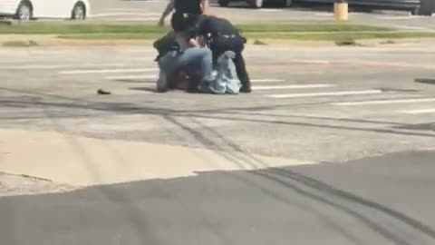 Woman waving a gun and pointing it at her head is moved down by cops on Long Island