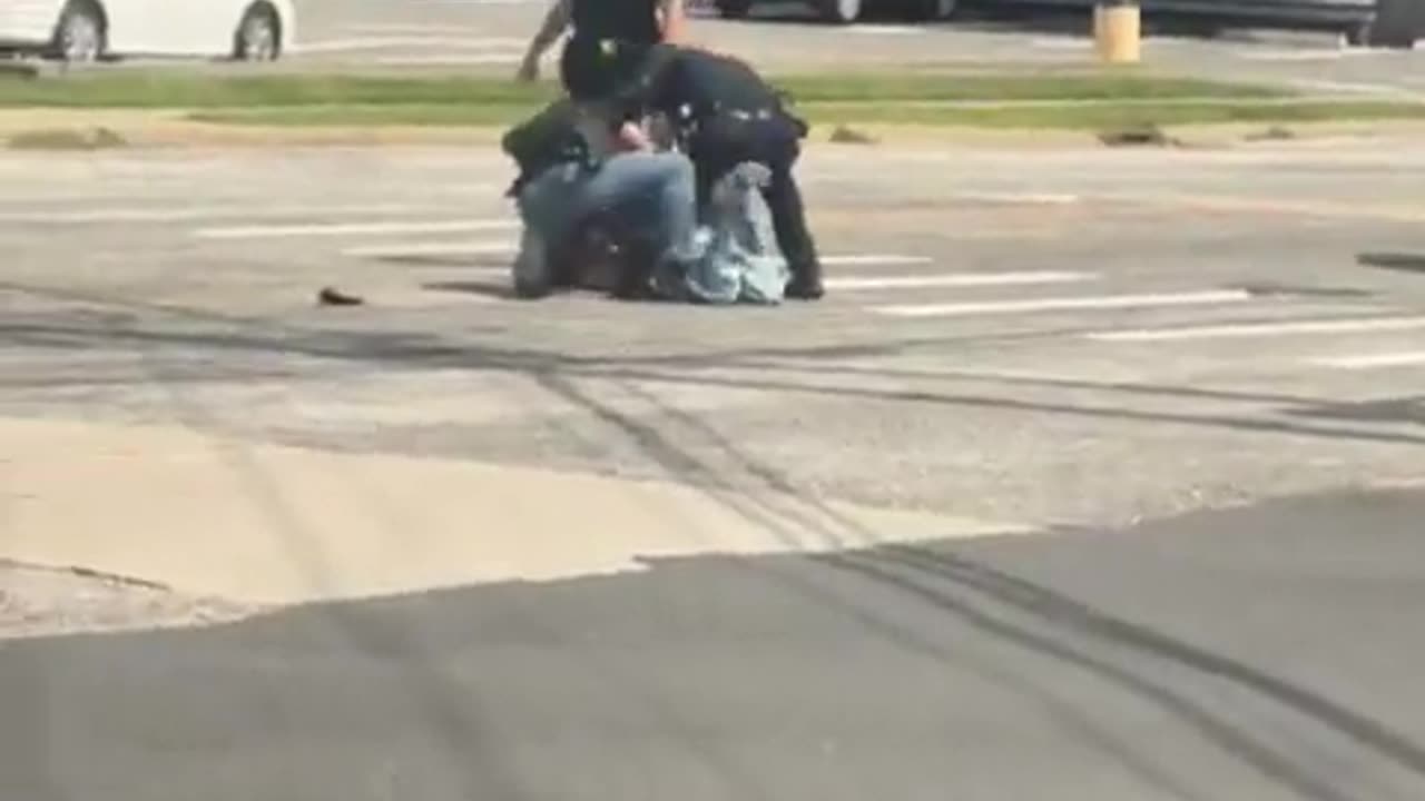 Woman waving a gun and pointing it at her head is moved down by cops on Long Island