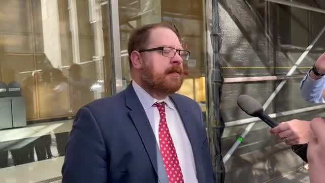 Miller, outside the court after being kicked out by Rouleau