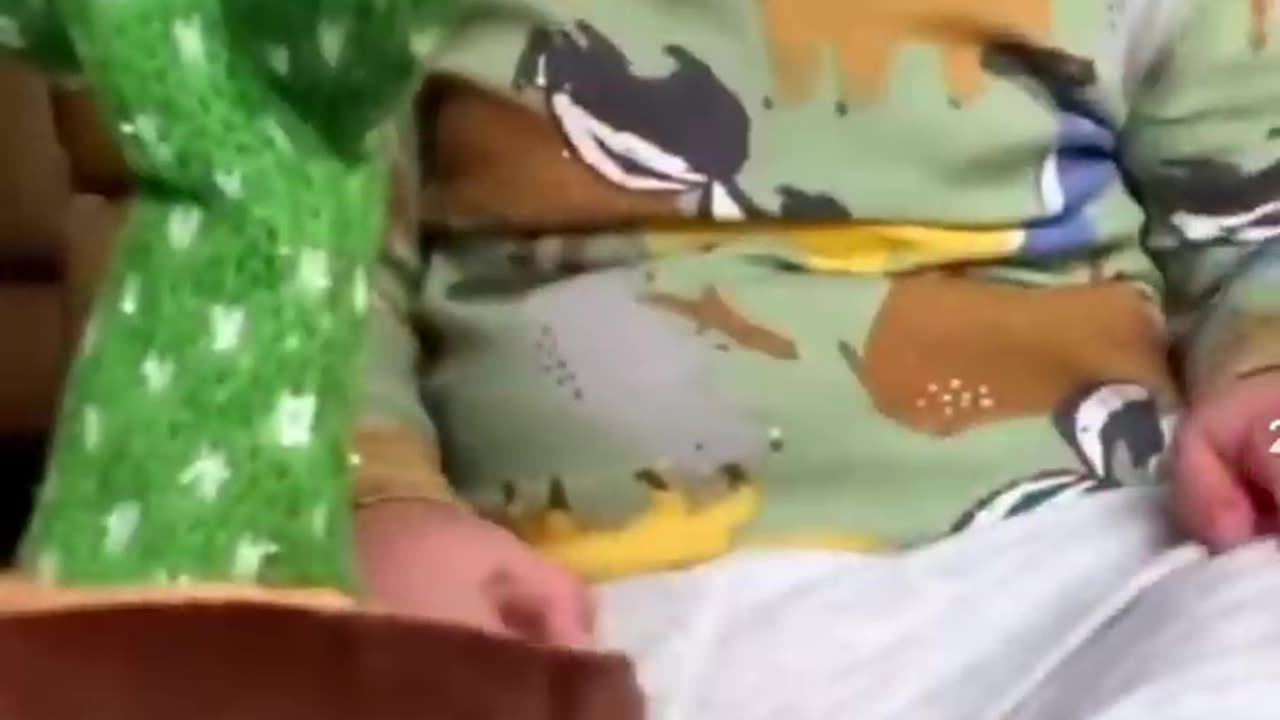 Cute baby playing with dancing cactus