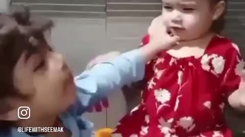 Brother sister fighting on toys