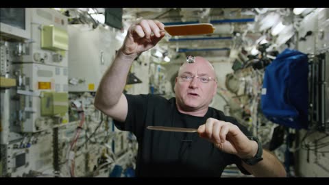 Astronaut playing ping pong in space