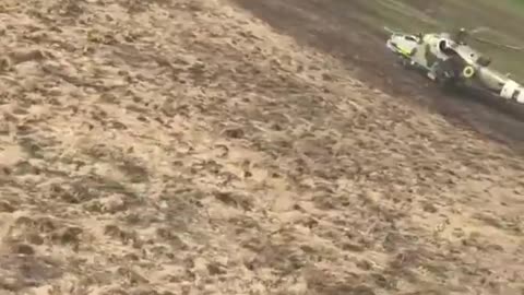 This boy with a flag in his hands meets Ukrainian pilots. One day, a helicopter