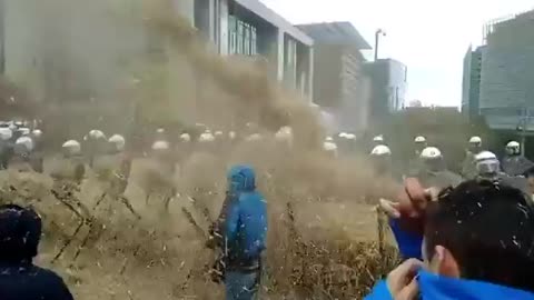 Dutch farmers spray manure on riot cops!