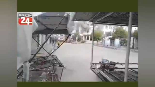 Syria, Assad's forces shooting protesters.
