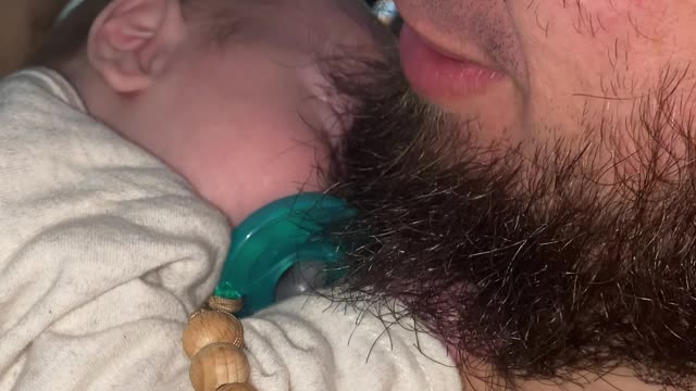 Baby Keeps Painfully Tight Hold on Dad