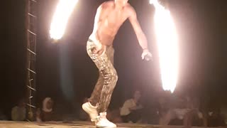 Guy bouncing with 2 fire wires