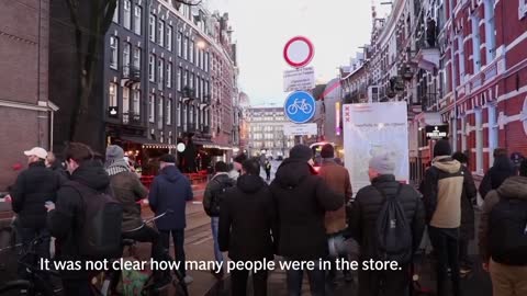 Amsterdam: Hostage drama at Apple store ends as gunman hit by police car