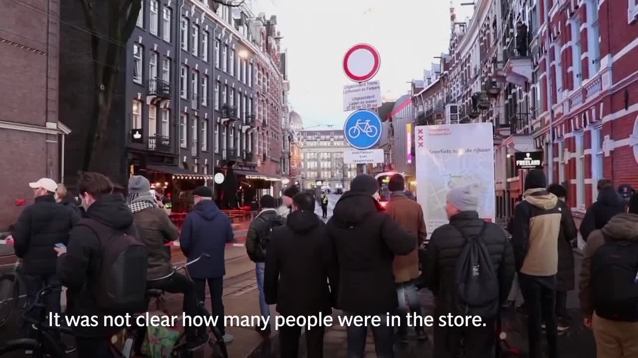 Amsterdam: Hostage drama at Apple store ends as gunman hit by police car