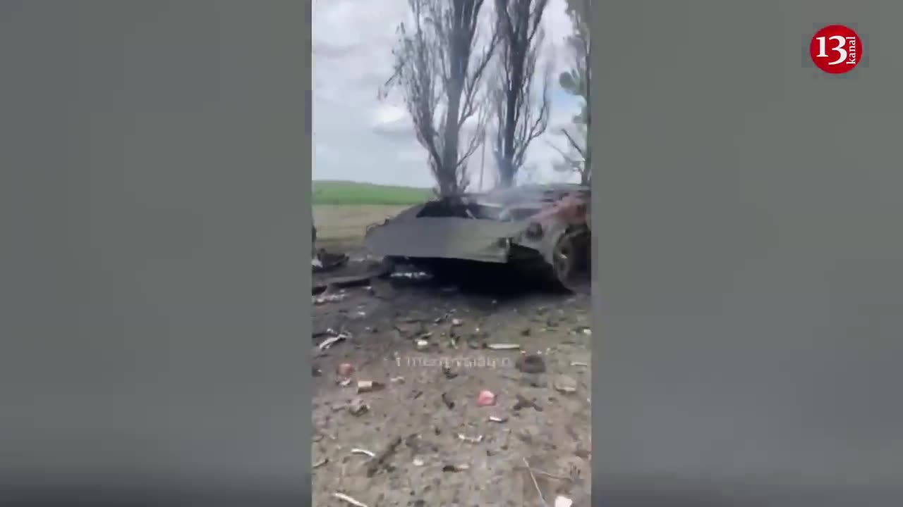 Ukrainian soldiers display Russian armored fighting vehicles burned to pieces after strike