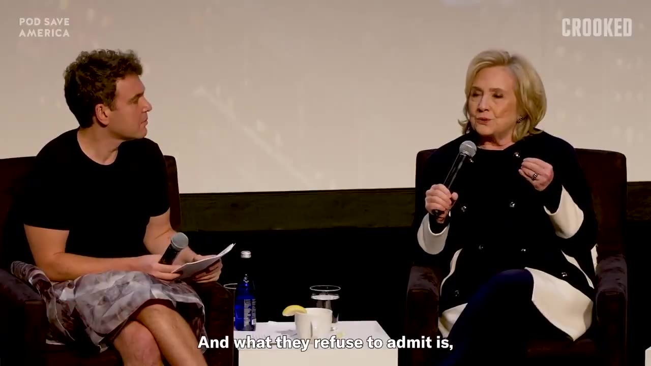 Hillary Clinton gets questioned by a man wearing a skirt