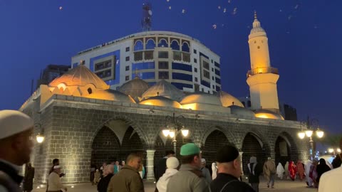 People walking outside a Mosque