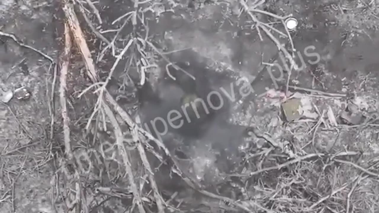 Ukrainian drone drops grenades on Russian soldier in a foxhole.