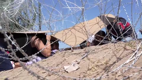 Savage Mother Crosses Toddler Under Razor Wire To Get Into USA