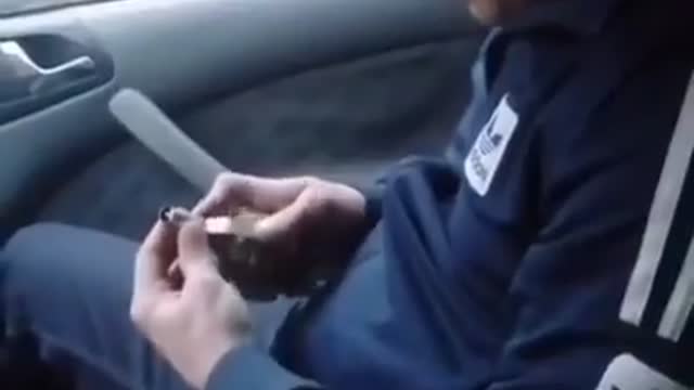 Ukrainian man accidentally pulls pin while inside a car.