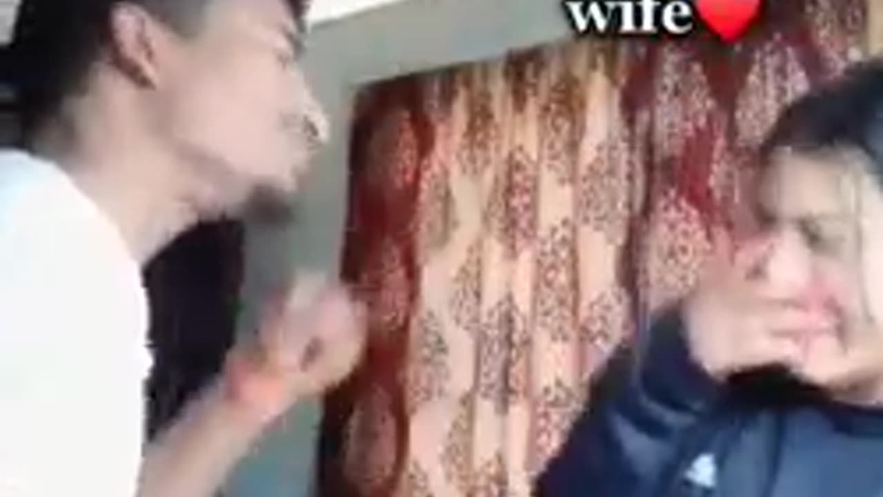 Husband with wife playing slapping game