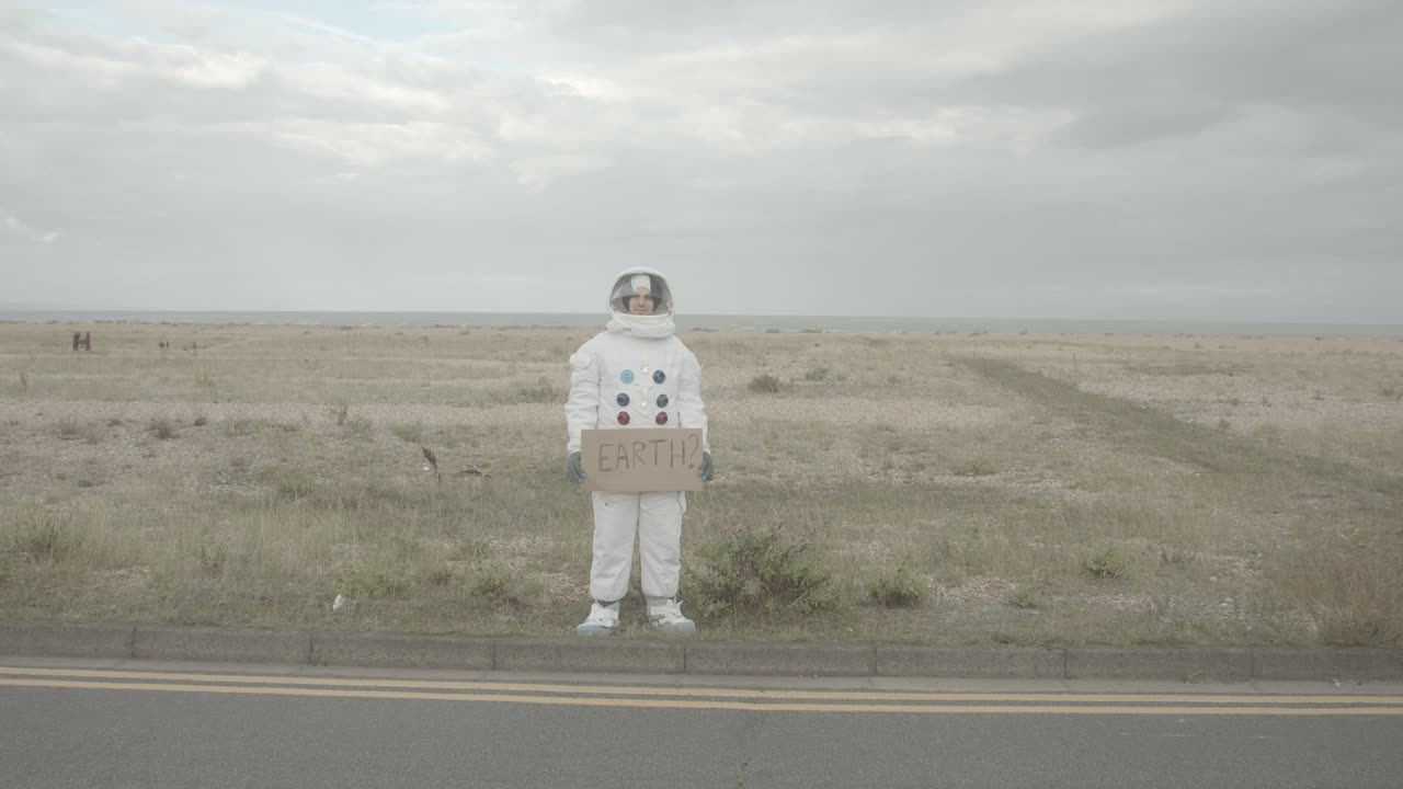 Astronaut holding a sign