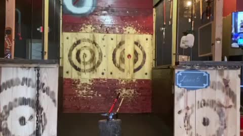 Guy Riding on Skateboard Throws Axes Without Looking and Hits Bullseye