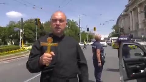 A Bulgarian priest had to be restrained as Zelensky passed through Sofia.