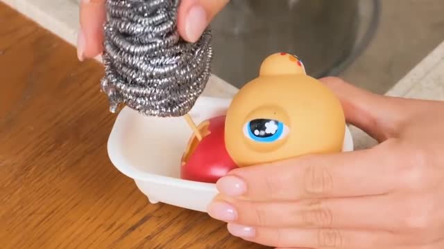 Decorate a Rubbish Pot with a plastic duck doll