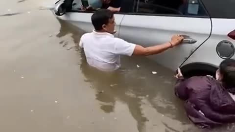 Car floating in flood water