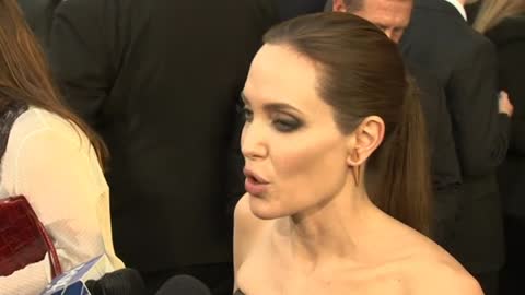 Angelina Hits Red Carpet For "Maleficent," Brad Attacked