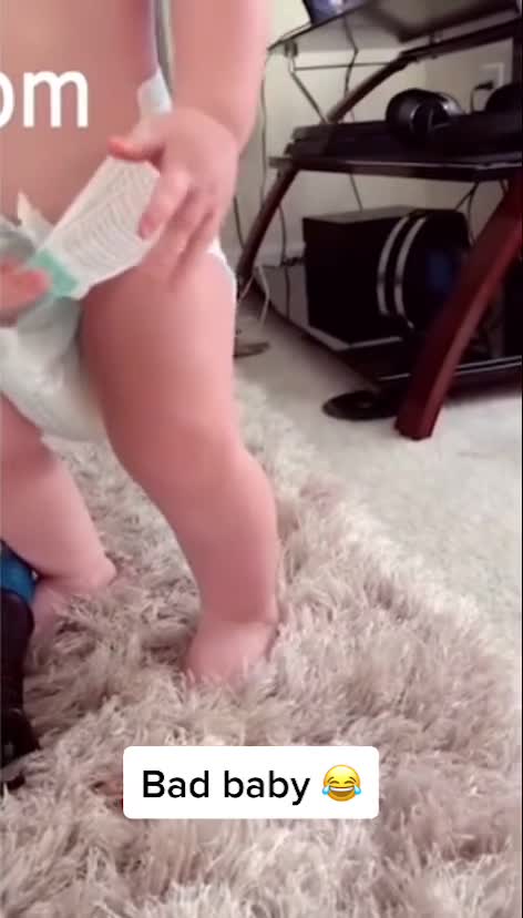 BABY TAKING HIS DIAPER OUT.mp4