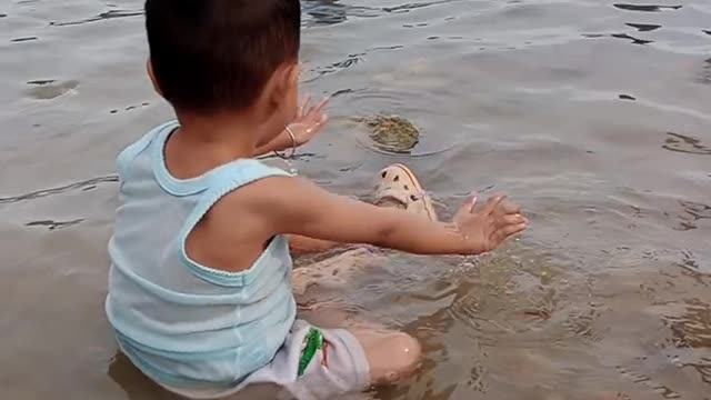 children playing on the beach with their friends are very happy