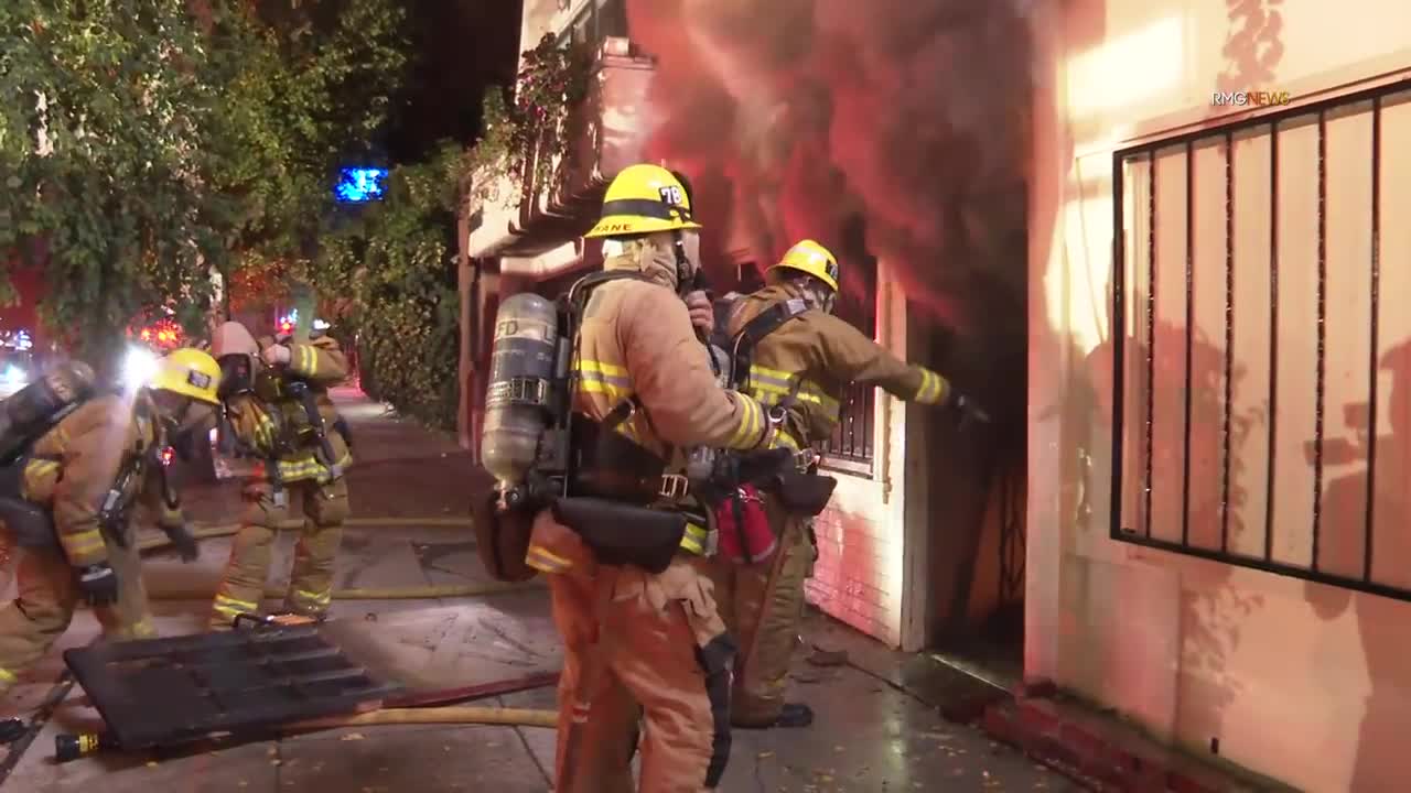 Firefighter catches fire while battling a structure fire in Sherman Oaks, California. (Not injured).