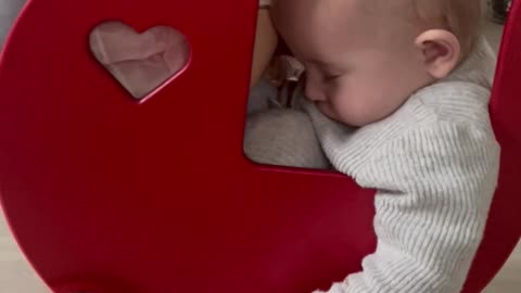 Baby Sleeps in Doll's Stroller