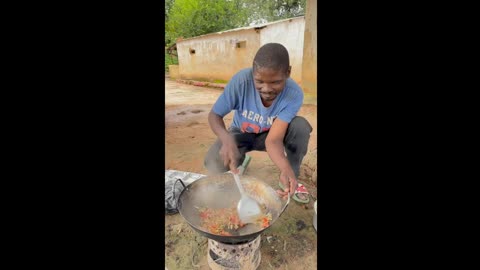 See how he cooks outdoors.