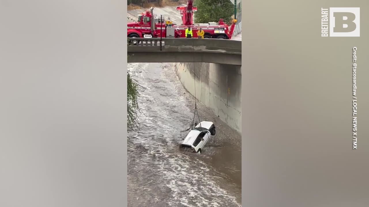 L.A. Firefighters Dangle from Bridge to Retrieve Car Swept Away by Tropical Storm Hilary