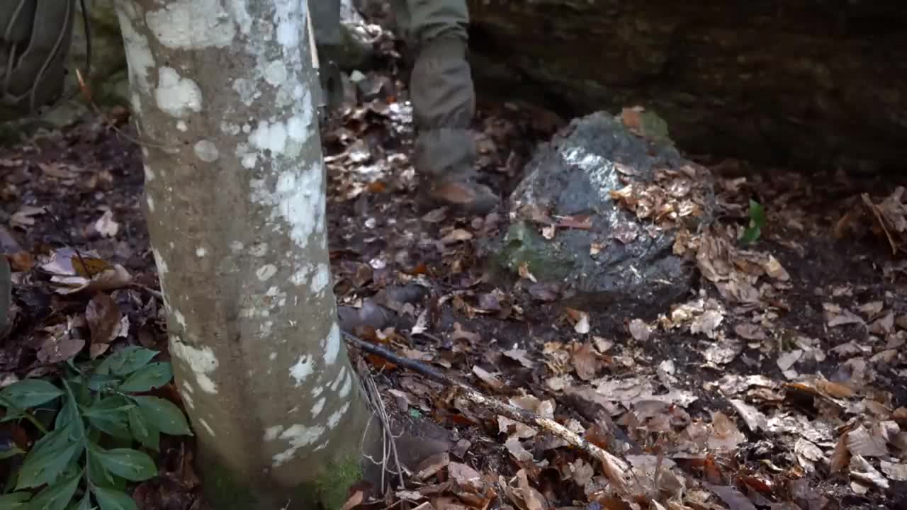 Four excavated shelter.Building underground bunker.Earth hut. primitive technology.Clay stone oven-7