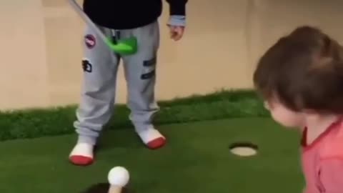 Kids playing golf