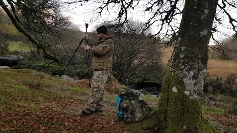 Assembling the tripod for filming next to a river