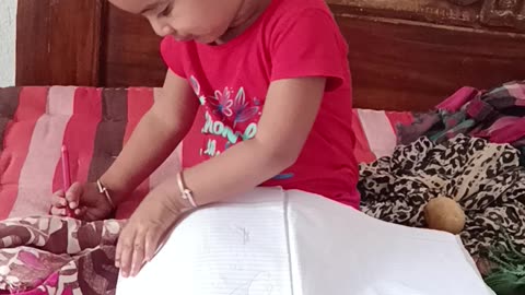 Cute baby girl reading