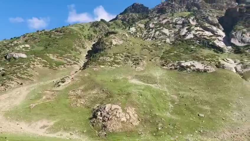 Kutwal Valley with beautiful snow covered mountains and lush greenery trees