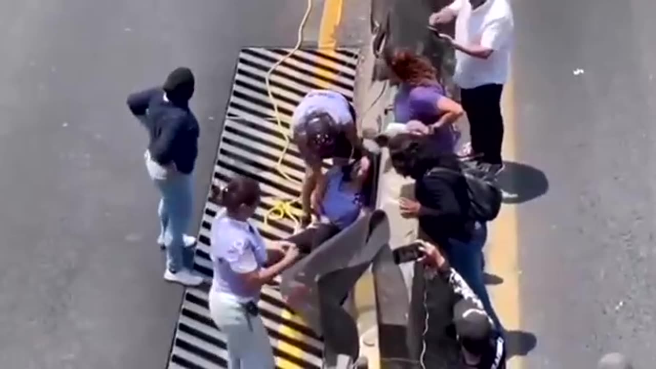 Protesters trying to block the road get instant karma served.