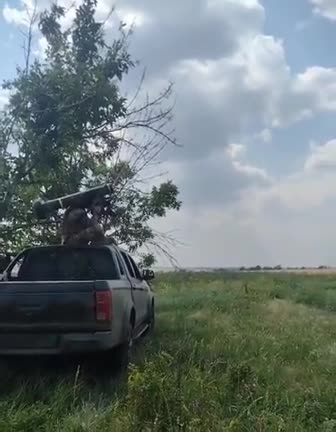 Ukrainian serviceman fires Javelin missile targeting a Russian tank