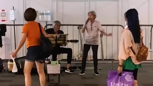 Elderly buskers surprised by viral fame, hope to spread joy with their songs