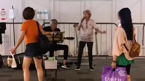 Elderly buskers surprised by viral fame, hope to spread joy with their songs