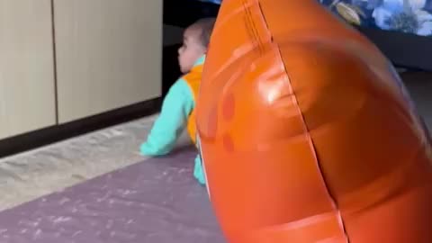 Baby plying balloon