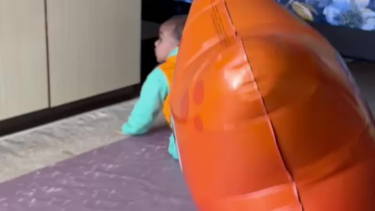 Baby plying balloon