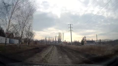 A Ukrainian soldier demonstrates the only remaining road that remained under the control