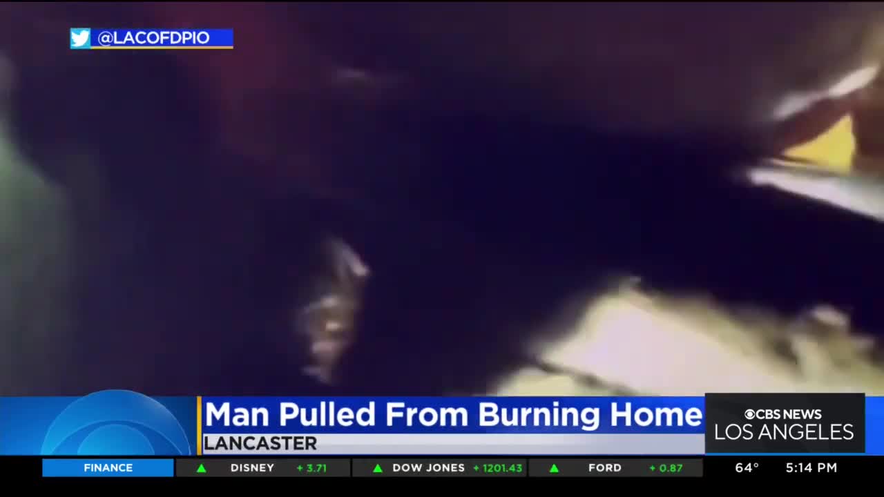 Dramatic video shows firefighters pulling man from burning home in Lancaster