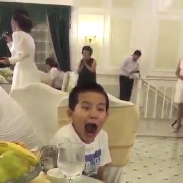 This boy sings with a great expression on his face.