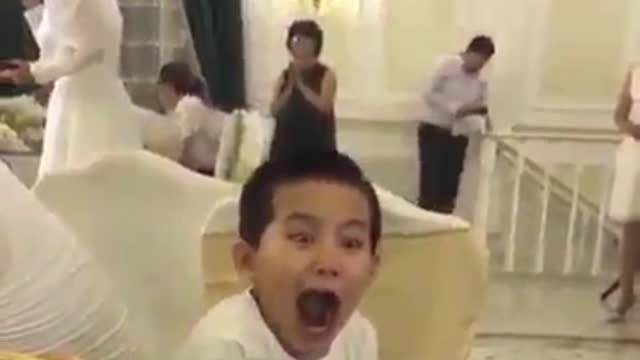 This boy sings with a great expression on his face.