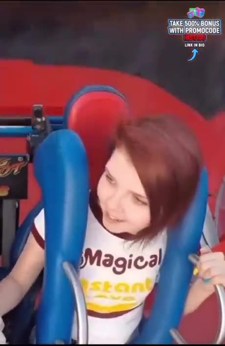 A woman riding a merry-go-round