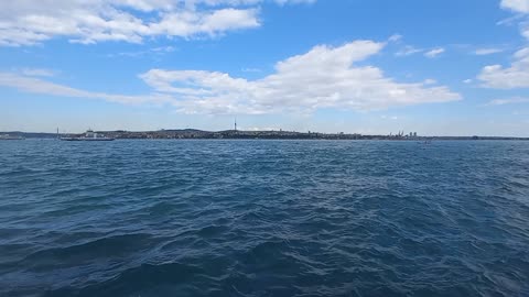 The beauty of the sea, calm waves and white clouds