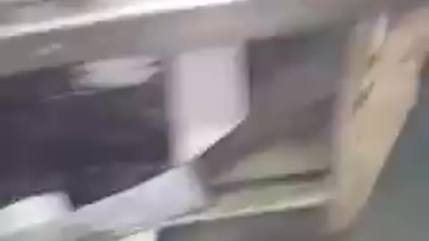 Cleaning a bracket on belt sander